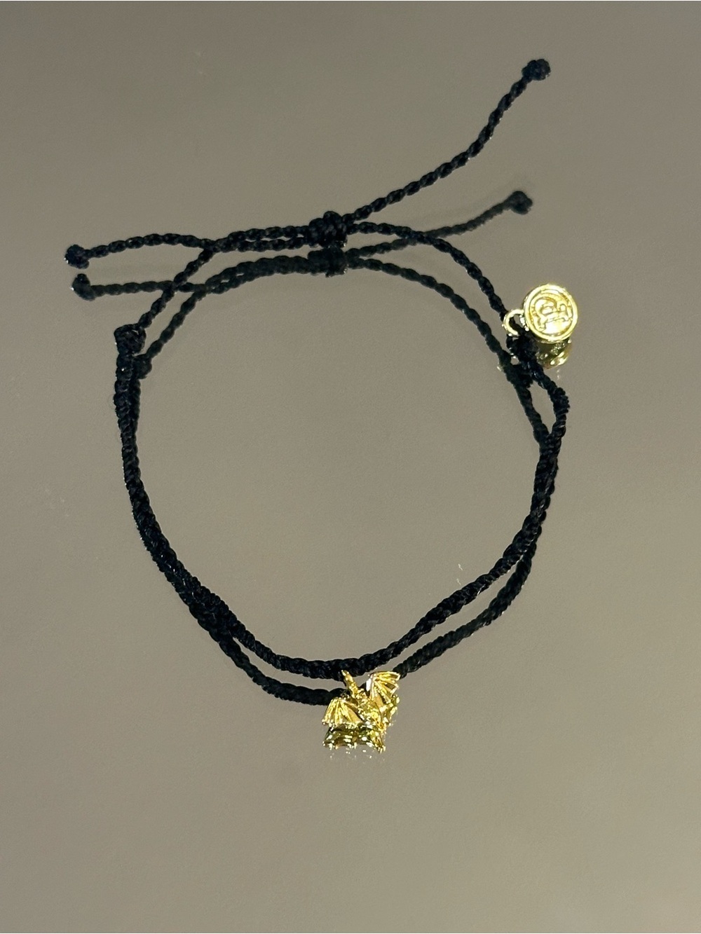 Pura Vida. Black Braided Cord Bracelet with Gold Bat Charm